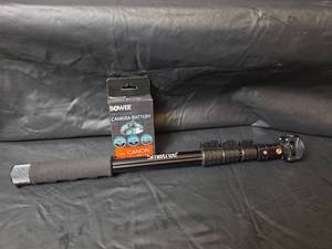 lot 410 image: Canon NB-11L Camera Battery and Smatree Monopod