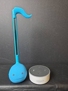 lot 505 image: Otamatone Electronic Musical Instrument and Amazon Echo Dot
