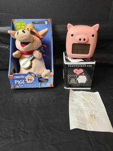 lot 563 image: Country Pigs Singing Banjo Plush Toy with Propitious Pig Glowing LED Digital Alarm Clock (needs batteries)