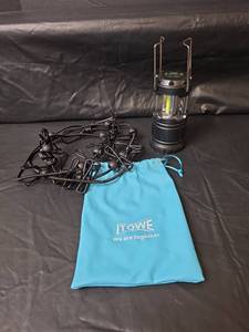 lot 571 image: iTOWE Portable Clothesline and Collapsible LED Camping Lantern