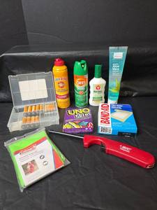 lot 573 image: Batteries, Insect Repellent, Lighter, First-aid, Poncho, and UNO Flip Game