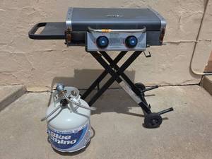 lot 79 image: Razor 2-Burner Portable Propane Flattop Griddle with Foldable Stand and Partial Filled Propane Tank