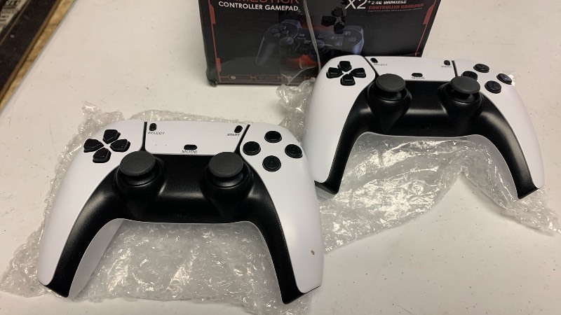 lot 167 image: X2 2.4G Wireless Controller Gamestick Console with 2 Controllers
