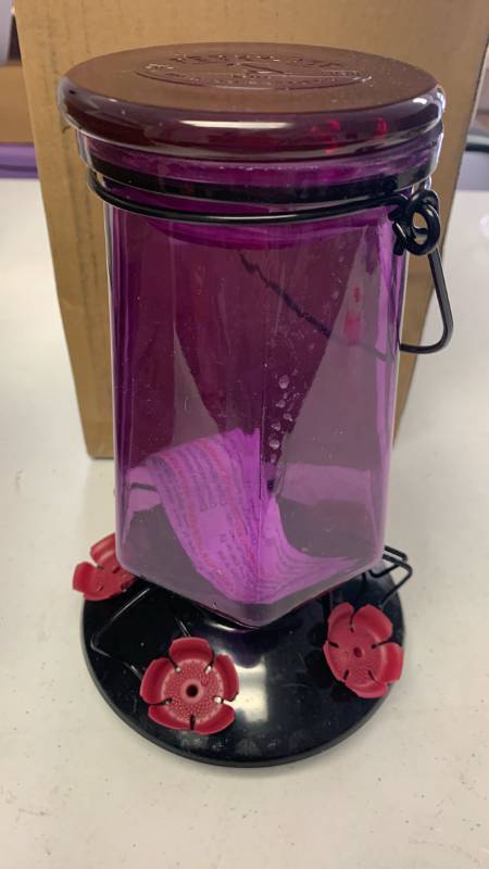 lot 17 image: Perky-Pet Lavender Field Top-Fill Glass Hummingbird Feeder with a 16 oz capacity and five feeding ports. appears to be used