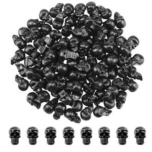 lot 20965 image: SaktopDeco 100 Counts Mini Black Skull Small Plastic Skull Heads Decor Halloween Skeleton Head for Crafts Bar Home Table Party Decorations - Retail $8