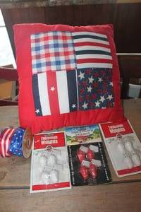 lot 1004 image: Vtg. Red and White Tablecloth Weights & More