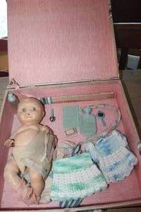 lot 1011 image: Vtg. Doll, Clothes & More in Carrying Case