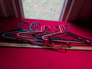 lot 18 image: 11 - Plastic Wire Coat Hangers Set