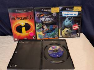lot 373 image: Nintendo GameCube Games Bundle - The Incredibles, Jimmy Neutron, Monsters Inc., War of Warcraft