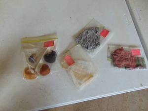 lot 1843 image: Selection of Barbie Wigs with Stand and Barbie Clothes