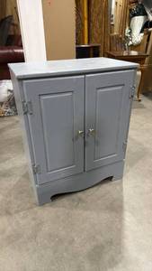lot 106 image: Blue 2 door cabinet 30 x 24 x 15 in