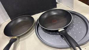 lot 1035 image: Wilton pizza pan, and 2 t-fal pans