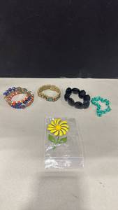 lot 1060 image: Bracelets and pin