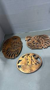 lot 2051 image: Brass Decorative Trivets Set with Rooster and Sailboat Designs