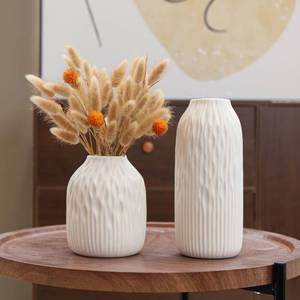 lot 1328 image: PhiDor White Ceramic Flower Vase Set of 2, Porcelain Cylindrical Dried Flowers Holder, Decorating for Drawing RoomTableStudyOffice Entryway, Modern Simple Boho Style (White) - Retail $30