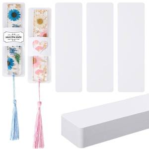 lot 1648 image: Fumete 50 Pieces Resin Bookmark Holder 5.9 x 1.8 Inches Kraft Bookmark Sleeves DIY Bookmarks Display Cards for Bookmark Wrapping Small Business Packaging Supplies Party Favor Gift (White, Cute) - Retail $9