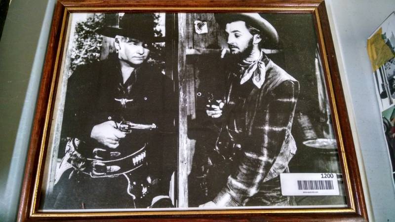 lot 1200 image: Framed Picture of Hopalong Cassidy in action
