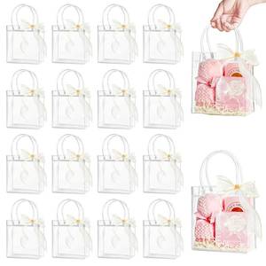 lot 531 image: Ohuimrt 30 PCS Clear Plastic Gift Bags with Handles, 5.9 x 6.3 x 2.8 Inches Reusable Party Favor Bags with Ribbon Transparent Gift Wrap Bags Bulk for Weddings Birthdays - Retail $15