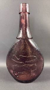 lot 63 image: VTG Wheaton Union Glass Bottle Amethyst with Dove Shield