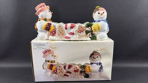 lot 124 image: Cardinal Snowman Candy Cane Holder Christmas Decoration 13 by 4 by 6 inches