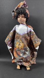 lot 314 image: Porcelain Doll with Traditional Dress and Headwrap
