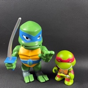 lot 318 image: Kid Robot and Playmates Teenage Mutant Ninja Turtles Action Figures