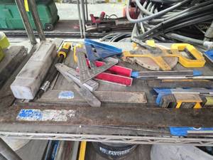 lot 17801 image: Mixed Hand Tools Including 100ft Measuring Tapes, Levels, Carpenter Squares and More