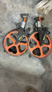 lot 17804 image: Orange Measuring Wheels with Handles -Set of 2