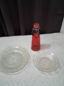 lot 35 image: Clear Pressed Glass Plates and Red Swing Top Bottle Set