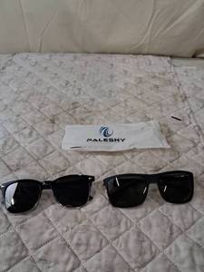 lot 63 image: Set of Black Sunglasses with Paleshy Cleaning Cloth
