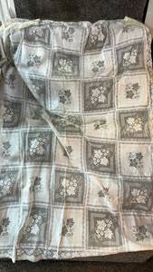 lot 79 image: Handmade Lace Tablecloth with Floral Pattern used condition could be beached or stained another color.