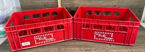 lot 179 image: The Pop Shoppe Red Plastic Bottle Crates Set of 2