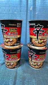 lot 2104 image: Nongshim Shin Ramyun Black Premium Instant Noodle Cups - 4 Pack