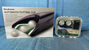 lot 2145 image: Brookstone Automatic Putting Cup with Golf Tool Kit Bundle