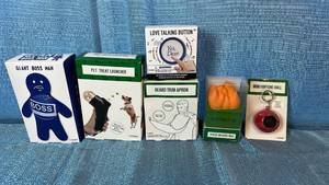 lot 2155 image: Novelty Gift Collection - Giant Boss Man, Pet Treat Launcher, Love Talking Button, Beard Trim Apron, Stress Ball, Fortune Ball
