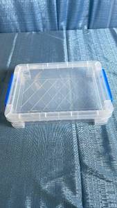 lot 3104 image: Clear Plastic Storage Container with Blue Handles