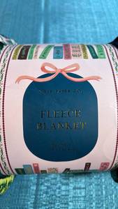 lot 8093 image: Rifle Paper Co. Book Spine Print Fleece Blanket 50x60 inches