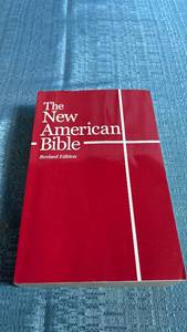 lot 8096 image: The New American Bible Revised Edition Red Paperback
