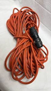 lot 3 image: Orange Extension Cord with Black Plug