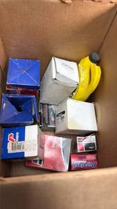 lot 97 image: Mixed Automotive Parts Lot - Brake Pads, Filters, and Engine Components