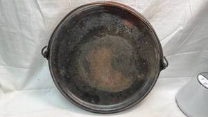 lot 99 image: Cast Iron Round Griddle with Wire Handle