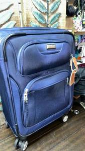 lot 97 image: Ricardo Navy Blue Rolling Suitcase with Telescoping Handle and 4 SWIVEL WHEELS