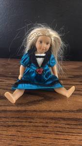lot 5471 image: Small Blonde Doll in Blue Dress with Rose Detail