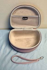 lot 111 image: Pink Hard Shell Headphone Carrying Case with Wrist Strap - Retail $15