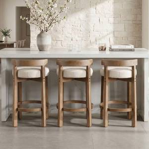 lot 442025 image: Retails for $327 LukeAlon Mid Century Linen Counter Stools Set of 3, Upholstered 26.5 Seat Height Low Barstools with Natural Wood Legs Round Low Back Kitchen Stools with Footrest for Dining Room, Beige