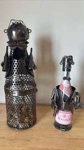 lot 1131 image: Metal Decorative Wine Bottle Holders with Character Figures