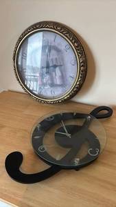 lot 1207 image: Wine Theme Wall Clock and Treble Clef Clock