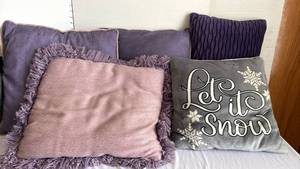 lot 1322 image: Four purple throw pillows and a Christmas throw pillow