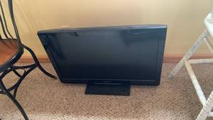 lot 2004 image: Panasonic 32 inch TV NO remote located in basement