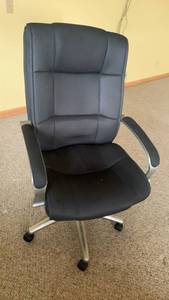 lot 2009 image: Large upholstered office chair 47X27X21 located in basement
